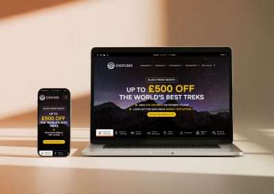 The EverTrek homepage showing Black Friday promotional graphics on a laptop and mobile device. Graphic Design by Yellow Cat Design.