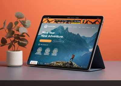 The EverTrek homepage shown on a tablet device with seasonal promotional banner. Web Design by Yellow Cat Design.